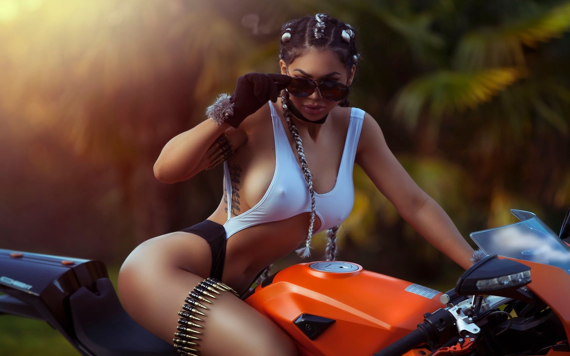 Girls with tattoos and motorcycles in Kumasi